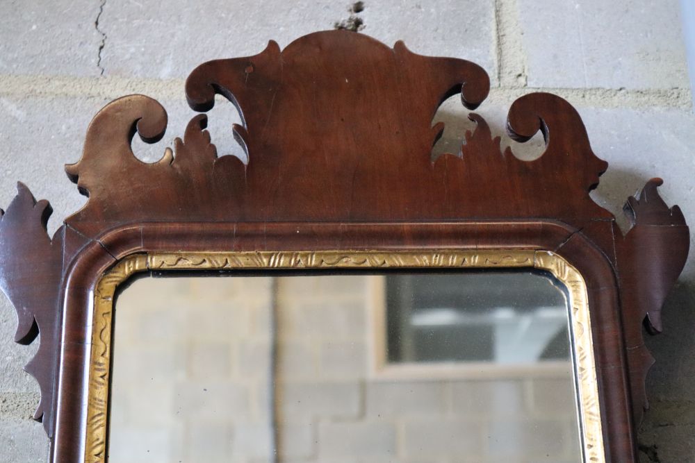 A small George III style mahogany fret cut wall mirror, width 40cm, height 70cm